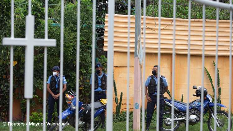 National Police officers keep watch outside a Catholic church where Rolando Alvarez, bishop and critical of the Nicaraguan President Daniel Ortega, is taking refuge alleging he had been targeted by the police, in Managua, Nicaragua May 20, 2022.