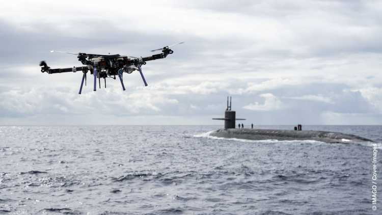 An unmanned aerial vehicle delivers a payload to the Ohio-class ballistic-missile submarine USS Henry M. Jackson around the Hawaiian Islands. Underway replenishment sustains the fleet anywhere anytime.